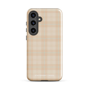 A smartphone with an impact-resistant beige plaid phone case featuring subtle light blue accents. The camera, flash, and sensor modules are visible at the top. The bottom part of the case has the text "Sophisticated Plaid for Samsung" printed on it by Statement Cases.