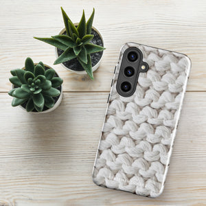 A Chunky Comfort for Samsung with a realistic knitted texture featuring white interwoven yarns. The impact-resistant case has multiple camera cutouts and a shock-absorbing dual-layer design. The brand name "Statement Cases" is printed at the bottom.