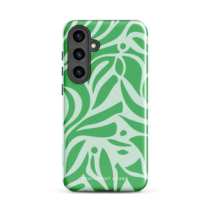 The Selva Verde for Samsung, a product by Statement Cases, is a durable, dual-layer phone case adorned with a green and white leafy design. The back of the case includes a camera cutout, and the bottom is printed with "Statement Cases.