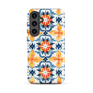 The Mediterranean Bloom for Samsung by Statement Cases features intricate, colorful floral patterns in blue, orange, and yellow. The design covers the entire back of the case, surrounding the camera cutout. Shock-absorbing and impact-resistant, it ensures protection while the brand "Statement Cases" is subtly printed near the bottom.