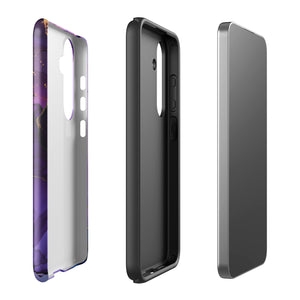 The Golden Orchid Marble for Samsung by Statement Cases is a smartphone adorned with a vibrant, abstract phone case showcasing a mix of purple, pink, and gold colors. Crafted from impact-resistant materials, it features a camera module with four lenses and a flash. At the bottom of the shock-absorbing phone case, you’ll find the text "STATEMENT CASES" in white.