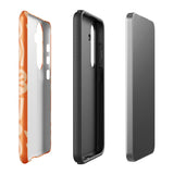 This stylish smartphone accessory, the Savannah Ardiente for Samsung by Statement Cases, features a shock-absorbing, colorful patterned case adorned with abstract flower designs in beige on an orange background. This impact-resistant phone case wraps around the back of your device, providing robust protection for its multiple camera lenses in the corner.