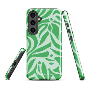 The Selva Verde for Samsung, a product by Statement Cases, is a durable, dual-layer phone case adorned with a green and white leafy design. The back of the case includes a camera cutout, and the bottom is printed with "Statement Cases.