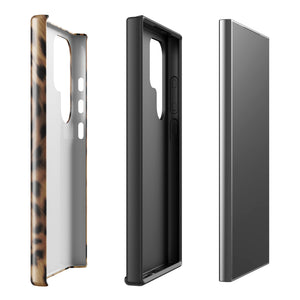 A smartphone with a leopard print, dual-layer design phone case featuring four camera lenses on the back is displayed against a white background. The bottom of the tough phone case has the brand name "Statement Cases" in white letters. The product name is "Daring Cheetah Fur for Samsung".