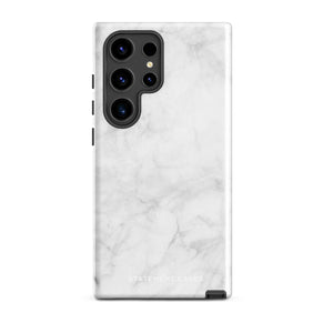 A dual-layer design smartphone case with a white marble pattern features three large camera lenses and a smaller one on the back. "Statement Cases" is subtly printed near the bottom. The minimalistic, matte finish offers impact-resistant protection with style.