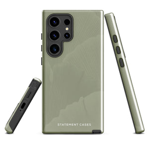 A Pistachio Haze for Samsung with a green phone case featuring a subtle floral pattern. This tough phone case has cutouts for three cameras and a flash, with the brand name "Statement Cases" printed at the bottom. The side buttons are visible, and there's a port at the bottom for easy access.