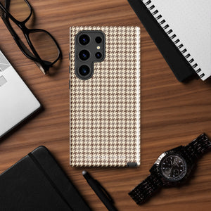 A Samsung smartphone with a beige and brown houndstooth patterned, impact-resistant case from Statement Cases. The phone features multiple cameras on the upper left side of its back. This tough Classic Houndstooth for Samsung phone case has a sleek, dual-layer design with precise cutouts for the cameras and buttons.