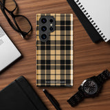 A dual-layer design phone case with a plaid pattern in shades of black, beige, and tan. Its impact-resistant build ensures durability while the camera cutout perfectly fits multiple lenses in the upper left corner. "Rich Espresso Tartan for Samsung" by Statement Cases is printed at the bottom against a white background.