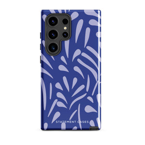 The Mariposa Azul for Samsung smartphone case from Statement Cases is adorned with an impact-resistant design featuring light purple abstract shapes on a blue background. This dual-layer case proudly displays the text "STATEMENT CASES" at the bottom, ensuring that the camera lenses and buttons of your phone remain clearly visible.