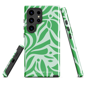 The Selva Verde for Samsung, a product by Statement Cases, is a durable, dual-layer phone case adorned with a green and white leafy design. The back of the case includes a camera cutout, and the bottom is printed with "Statement Cases.